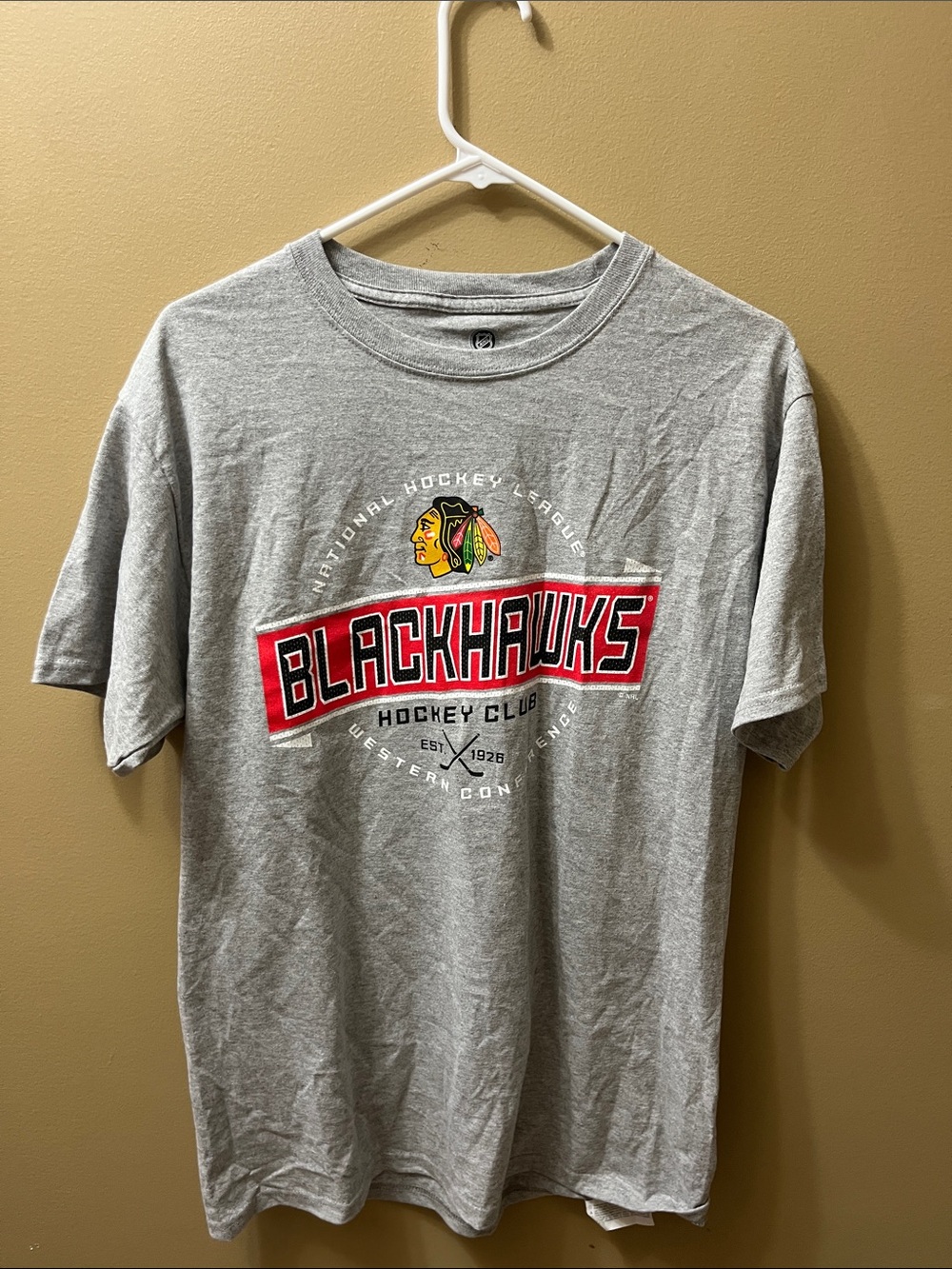 NHL Gray Blackhawks Short Sleeve Tee with Red and Yellow Logo